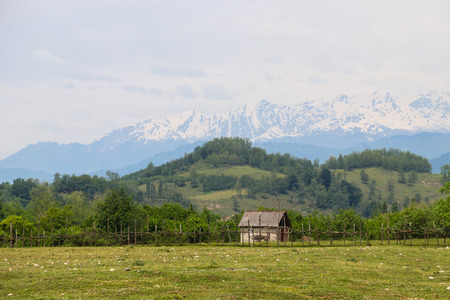 Old wooden barn in the village in Caucasus mountainsの写真素材