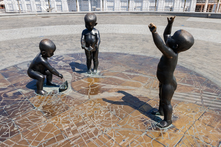 Kiev, Ukraine - July 28, 2018: Children's monument to the founders of Kiev on Poshtova Square. The founders of Kiev are depicted as little children playing with paper ships on a stylized mapのeditorial素材