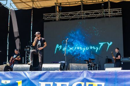 Dnipropetrovsk region, Ukraine - June 2, 2018: Rock band performs on a stage during outdoor free ethno-rock festival Kozak Festのeditorial素材