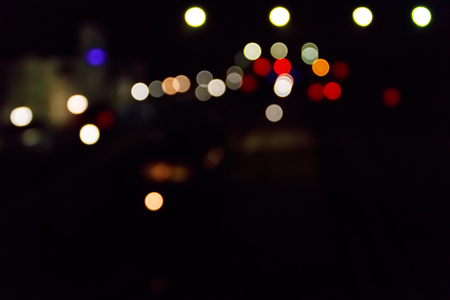 Abstract background of blurred city lights with bokeh effectの写真素材