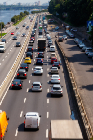 Blurred abstract background of traffic cars on the multi lane highway during rush hourの写真素材