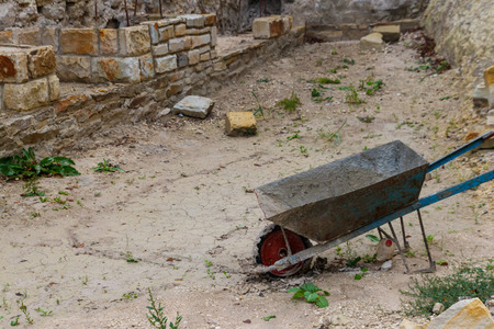Wheelbarrow or trolley in construction site. Construction industry conceptの写真素材