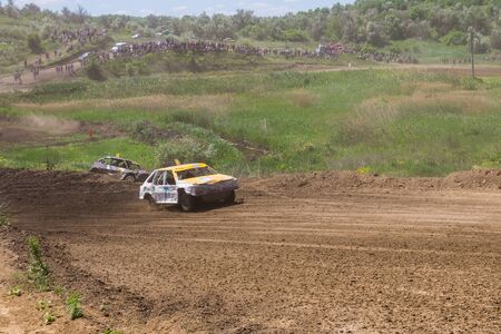 Alexandria, Ukraine - June 10, 2017: Race of the old wrecked cars. Racing in the open air with dustのeditorial素材