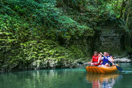 Martvili,, Georgia - May 5, 2018: Tourists rafting in rubber boats on the river Abasha in Martvili canyonのeditorial素材