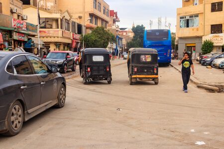 Cairo, Egypt - December 8, 2018: Traffic on street in poor residential district in Cairo, Egyptのeditorial素材