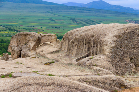 Old cave city Uplistsikhe in Caucasus mountains, Georgiaの写真素材