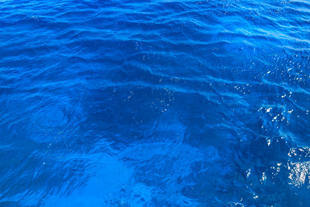 Blue water texture background. Surface of the sea