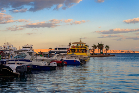 White yachts in the sea harbor of Hurghada, Egypt. Port with tourist boats on the Red Seaの写真素材
