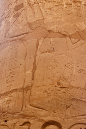 Ancient Egyptian fertility god Min carved on column in Great Hypostyle Hall in Karnak temple complex in Luxor, Egyptの写真素材