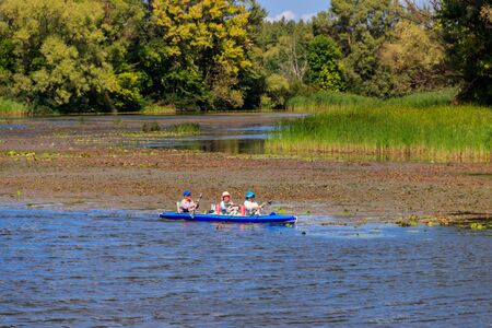 Kremenchug, Ukraine - August 22, 2018: Senior people kayaking on the Dnieper riverのeditorial素材