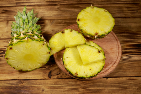 Fresh pineapple on wooden tableの写真素材