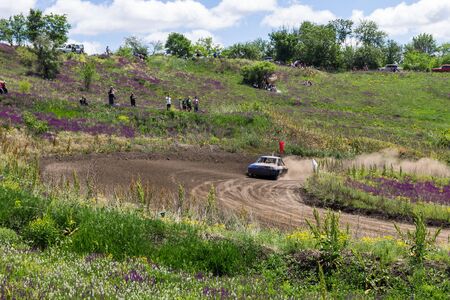 Alexandria, Ukraine - June 10, 2017: Race of the old wrecked cars. Racing in the open air with dustのeditorial素材