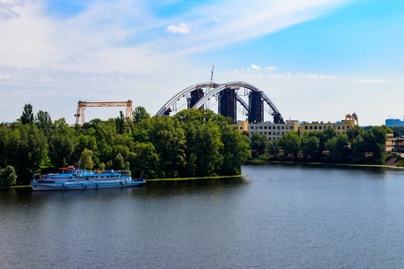 Podilsko-Voskresenskyi Bridge or Podilskyi Metro Bridge is a combined road-rail bridge over the Dnieper River under construction in Kiev, Ukraineの写真素材