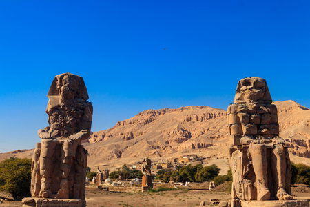 Colossi of Memnon, two massive stone statues of pharaoh Amenhotep III in Luxor, Egyptの写真素材