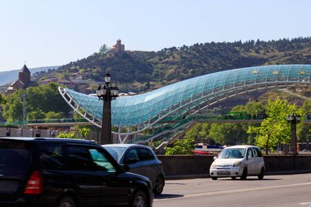 Tbilisi, Georgia - May 1, 2018: Bridge of Peace in Tbilisi. Pedestrian bridge over the Kura river