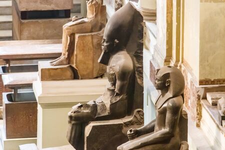 Cairo, Egypt - December 8, 2018: Large stone statues of pharaohs in Museum of Egyptian Antiquities, known commonly as the Egyptian Museum or Museum of Cairo, in Cairo, Egyptのeditorial素材