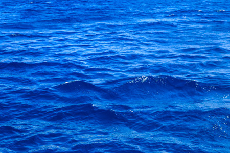 Blue water texture background. Surface of the sea