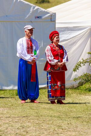Dnipropetrovsk region, Ukraine - June 2, 2018: Unknown people in traditional ukrainian clothing during ethno-rock festival Kozak Festのeditorial素材