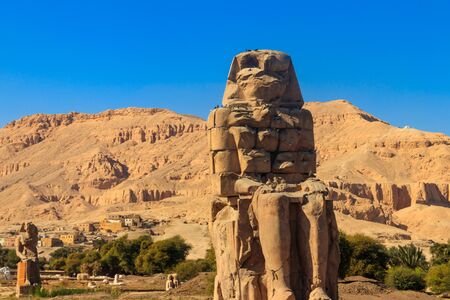 Colossi of Memnon, two massive stone statues of pharaoh Amenhotep III in Luxor, Egyptの写真素材