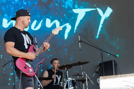 Dnepropetrovsk region, Ukraine - June 2, 2018: Guitarist  play electricity guitar on concert stage...