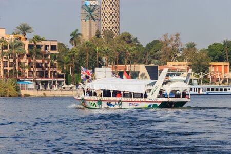 Cairo, Egypt - December 8, 2018: Pleasure boat on sailing down the Nile river in Cairo, Egypt