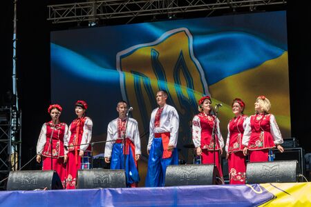 Dnipropetrovsk region, Ukraine - June 2, 2018: People in traditional ukrainian clothing performs on a stage during outdoor free ethno-rock festival Kozak Festのeditorial素材