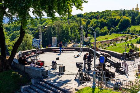 Kiev, Ukraine - August 24, 2019: Workers prepare a set and set up equipment before shooting a movie...