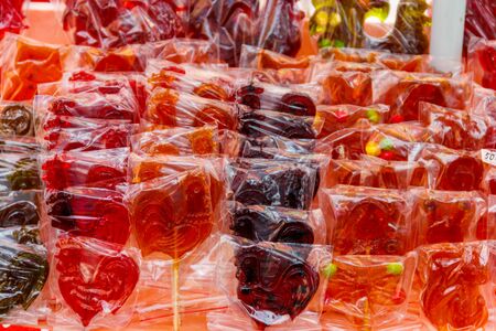 Rooster shaped lollipops for sale at street market. Traditional russian lollipopsの写真素材