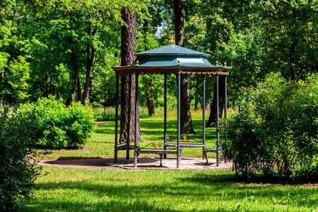 Wrought iron gazebo in a park at summerの写真素材