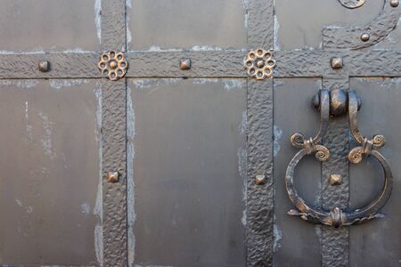 Close-up of the old iron black doorの写真素材