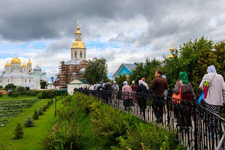 Diveyevo, Russia - August 10, 2019: Pilgrims walking and praying on Holy Groove (Kanavka) in Holy...