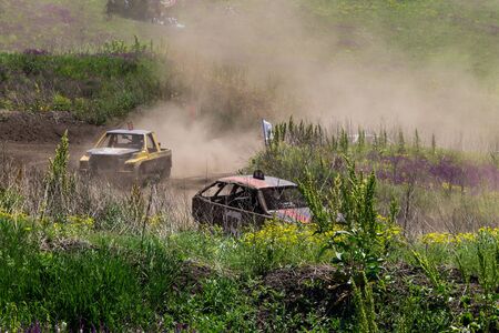 Alexandria, Ukraine - June 10, 2017: Race of the old wrecked cars. Racing in the open air with dustのeditorial素材