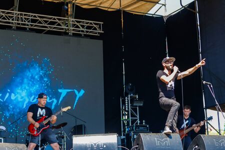 Dnipropetrovsk region, Ukraine - June 2, 2018: Rock band performs on a stage during outdoor free ethno-rock festival Kozak Festのeditorial素材