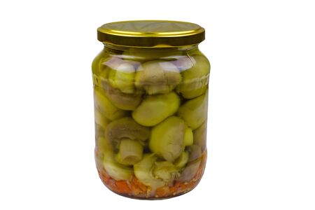 Delicious marinated mushrooms in glass jar isolated on white backgroundの写真素材