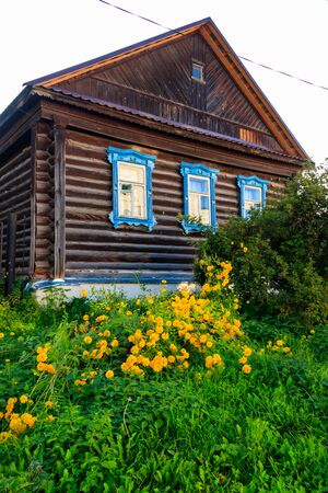Old wooden log house in a russian villageの写真素材
