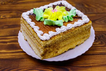 Tasty sweet cake on a wooden table