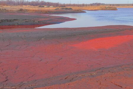 Technical settler of industrial water of mining industry with red soil polluted with iron ore waste...