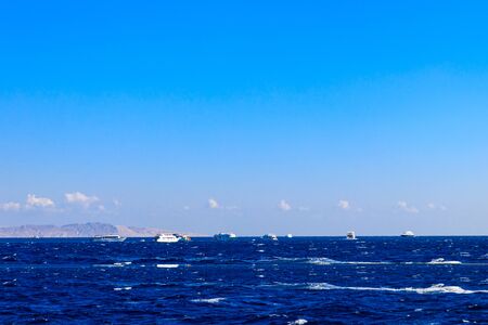 View of Red sea and white yachts on horizon near Hurghada, Egypt