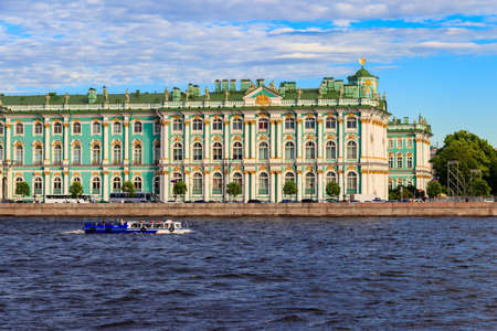 St. Petersburg, Russia - June 24, 2019: Pleasure boat with tourists sailing on the Neva river in front of Winter Palace in Saint Petersburg, Russiaのeditorial素材