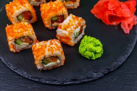Sushi rolls Philadelphia on a black slateの写真素材