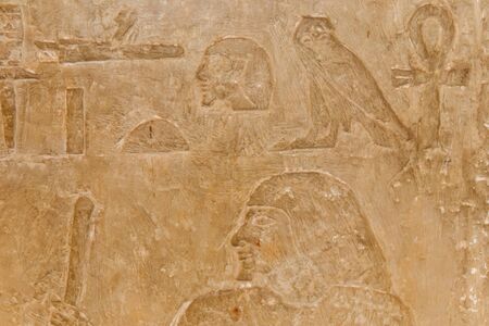 Ancient egyptian hieroglyphs carved on the stone wallの写真素材