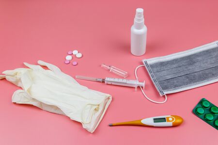 Concept of a prevention and treatment coronavirus. Medical mask, hand sanitizer, electronic...