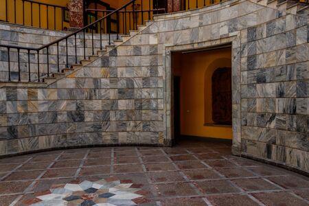 Staircase covered with red carpet in a lobbyの写真素材