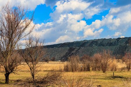 View of slag heaps of iron ore quarry. Mining industry