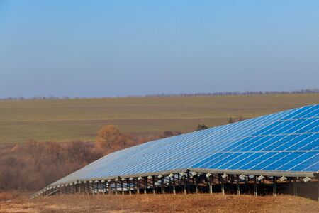 Rows of solar panels in solar power plant. Photovoltaic modules for innovation alternative energyの写真素材