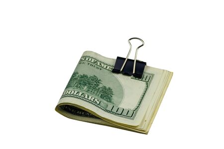Bundle of bills of american one hundred dollars in paper clip isolated on white backgroundの写真素材
