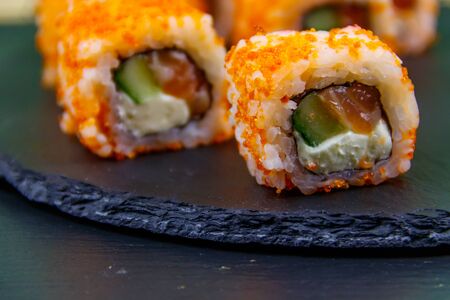 Sushi rolls Philadelphia on a black slateの写真素材