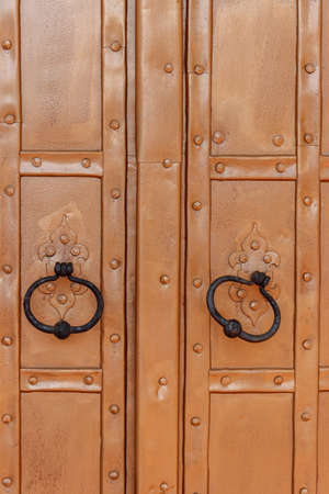 Close-up of the old iron brown doorの写真素材