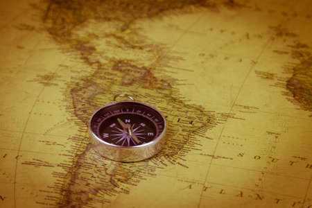 Compass on a vintage world map. Retro styleの写真素材