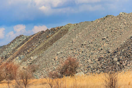 View of slag heaps of iron ore quarry. Mining industry